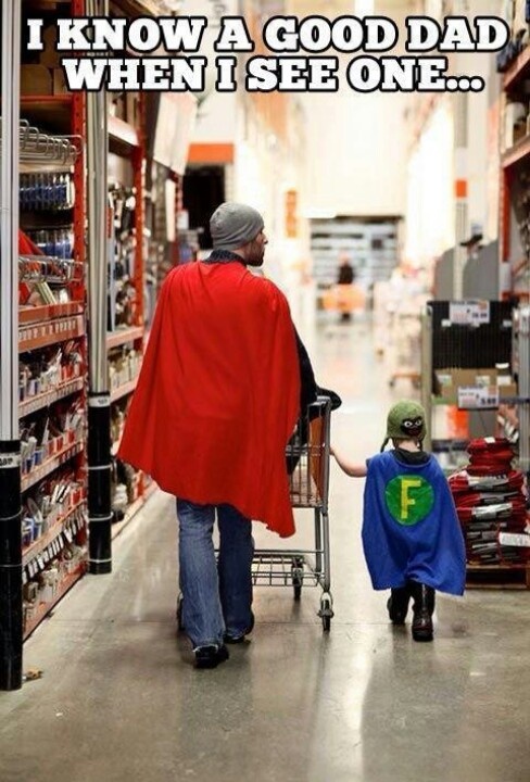 Dad and son in matching superhero outfits