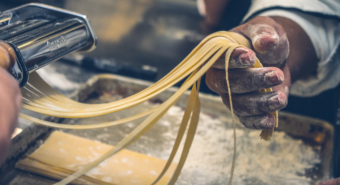 unique valentine's day gifts with person making homemade pasta