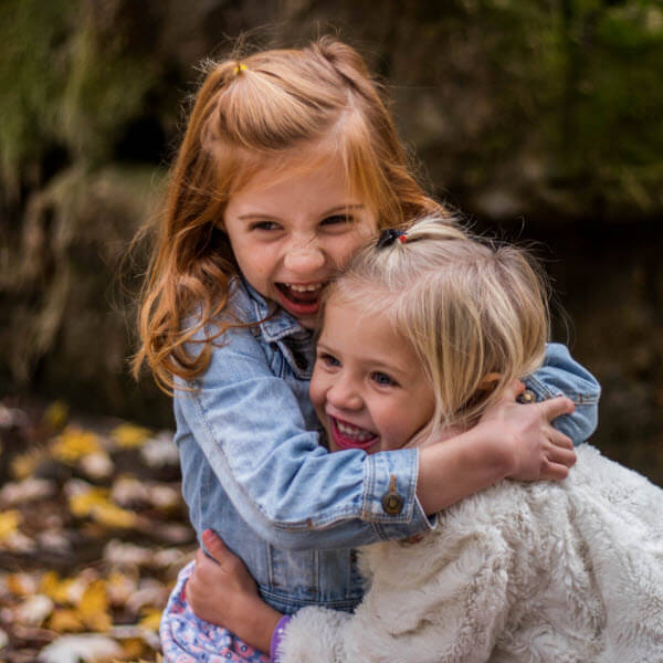 Siblings Day Activities with two sisters hugging