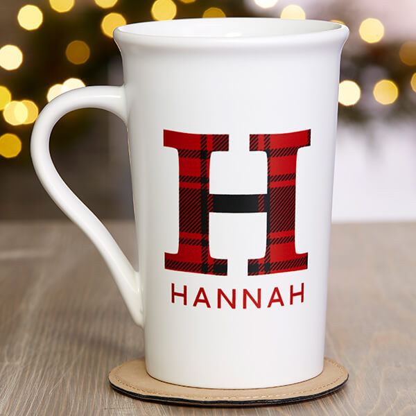 Personalized plaid decor with a mug that says 'Hannah' on it.