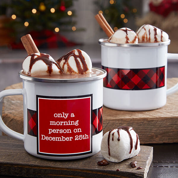 Personalized plaid decor with two plaid mugs of hot coco.
