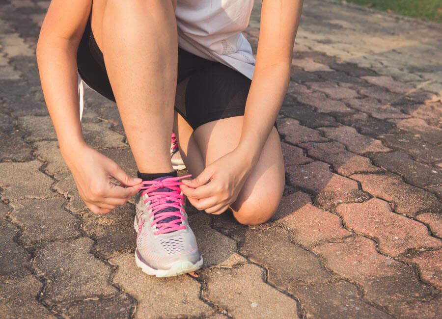 New Year's Resolutions runner tying shoes