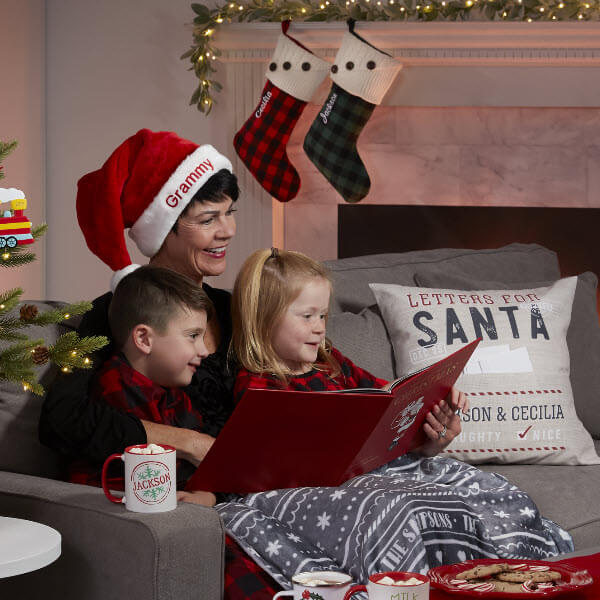 Christmas Traditions for Kids with grandma reading book to grandkids