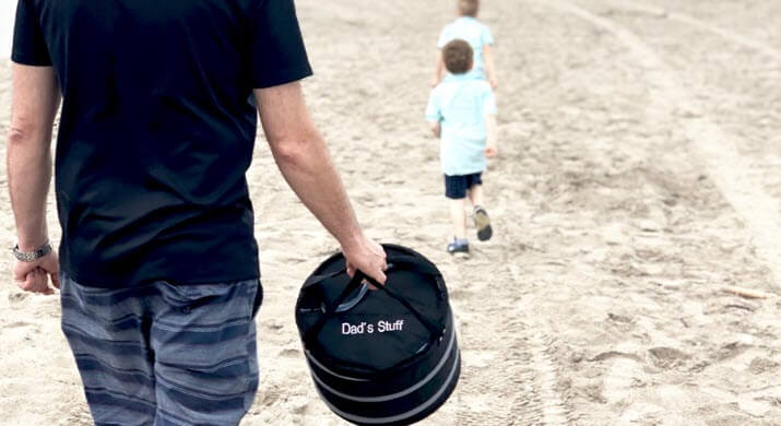 experience gifts with dad walking on beach with sons