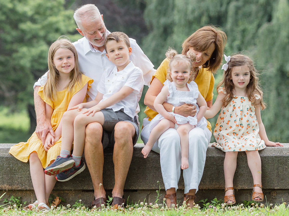family photos with grandparents posing for photo with grandkids