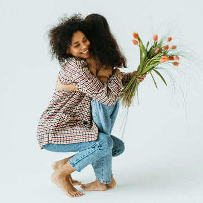 last minute mothers day gifts with mom with flowers hugging daughter