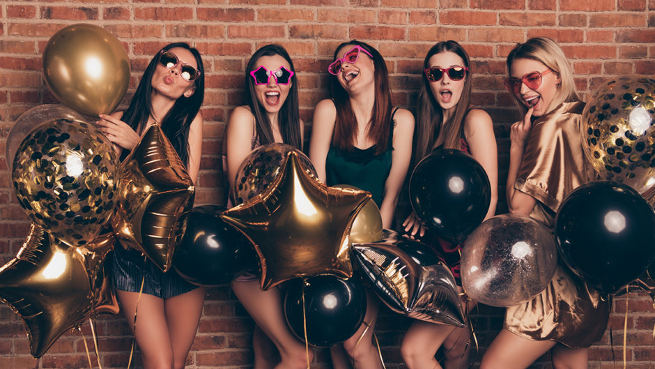 Nice looking company attractive fascinating fashionable gorgeous lovely cheerful cheery ecstatic excited positive ladies having fun isolated over industrial brick wall