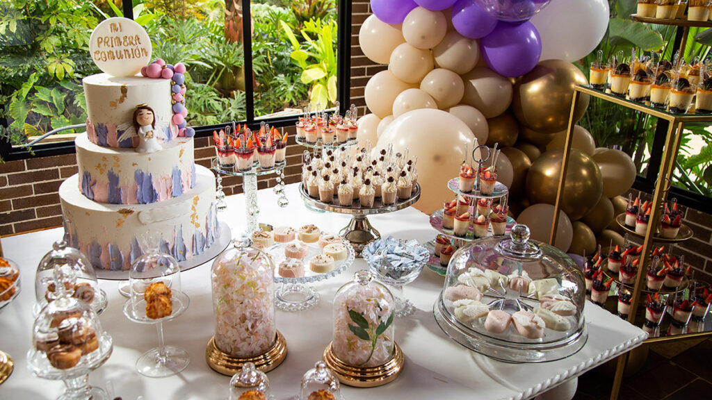 Table of desserts and sweets at the first communion party